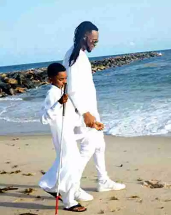Singer Flavour Gets Accolades As He Features Blind Boy In " Most High " Video (Photos)